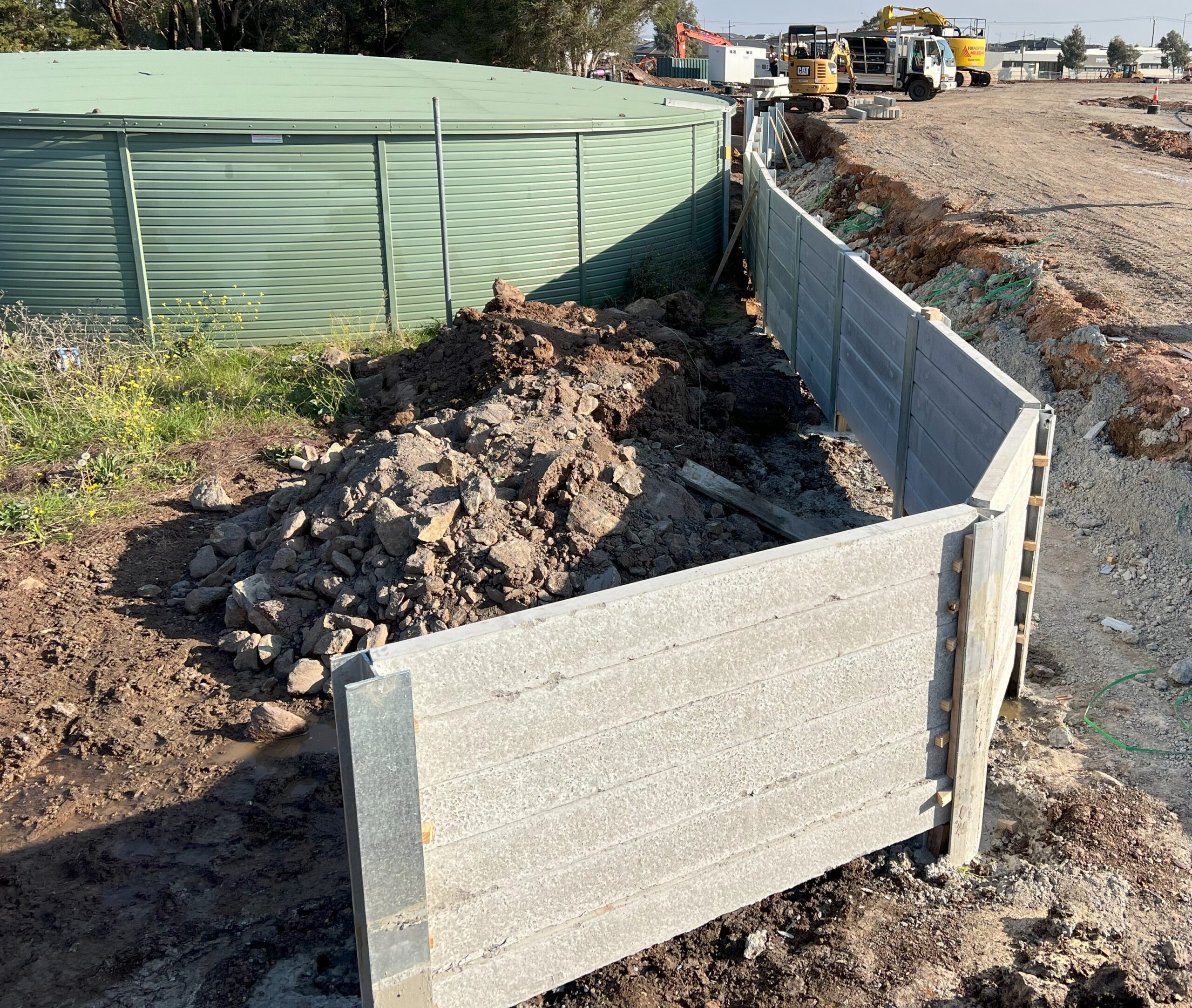 principles of retaining wall design and placement, including drainage, height requirements, material selection, and compliance