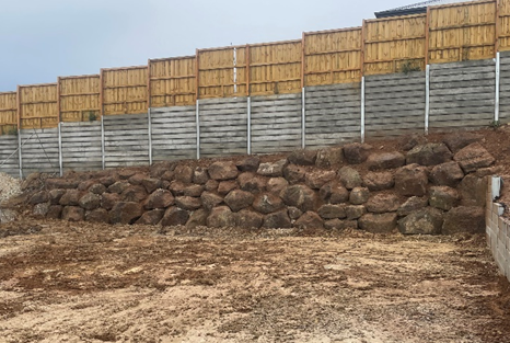 Rock retaining wall built on sloped site in Geelong for erosion control and landscaping