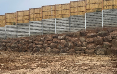 Rock retaining wall built on sloped site in Geelong for erosion control and landscaping