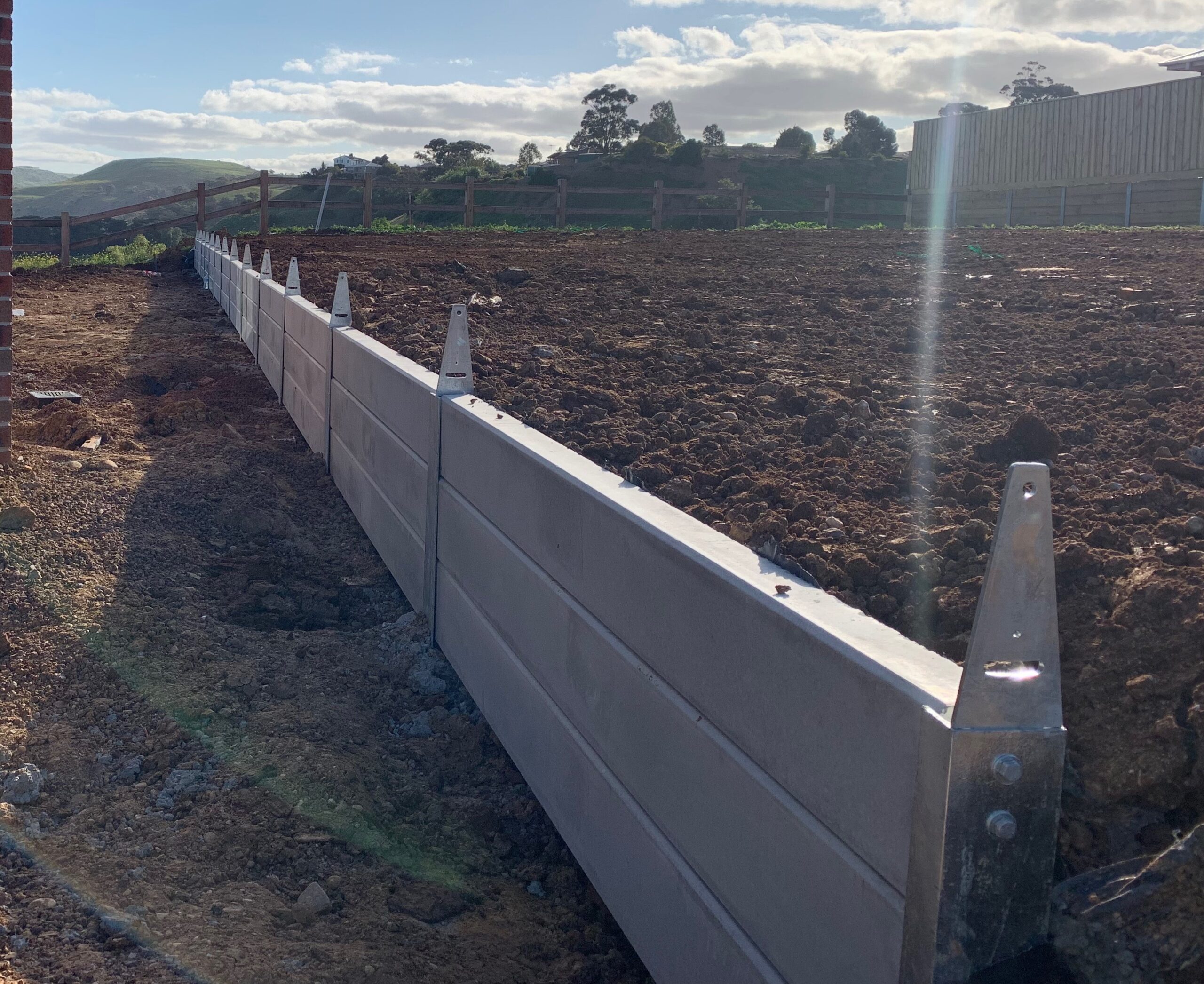 Concrete sleeper retaining wall installed in Ballarat backyard – Outwest Retaining Walls